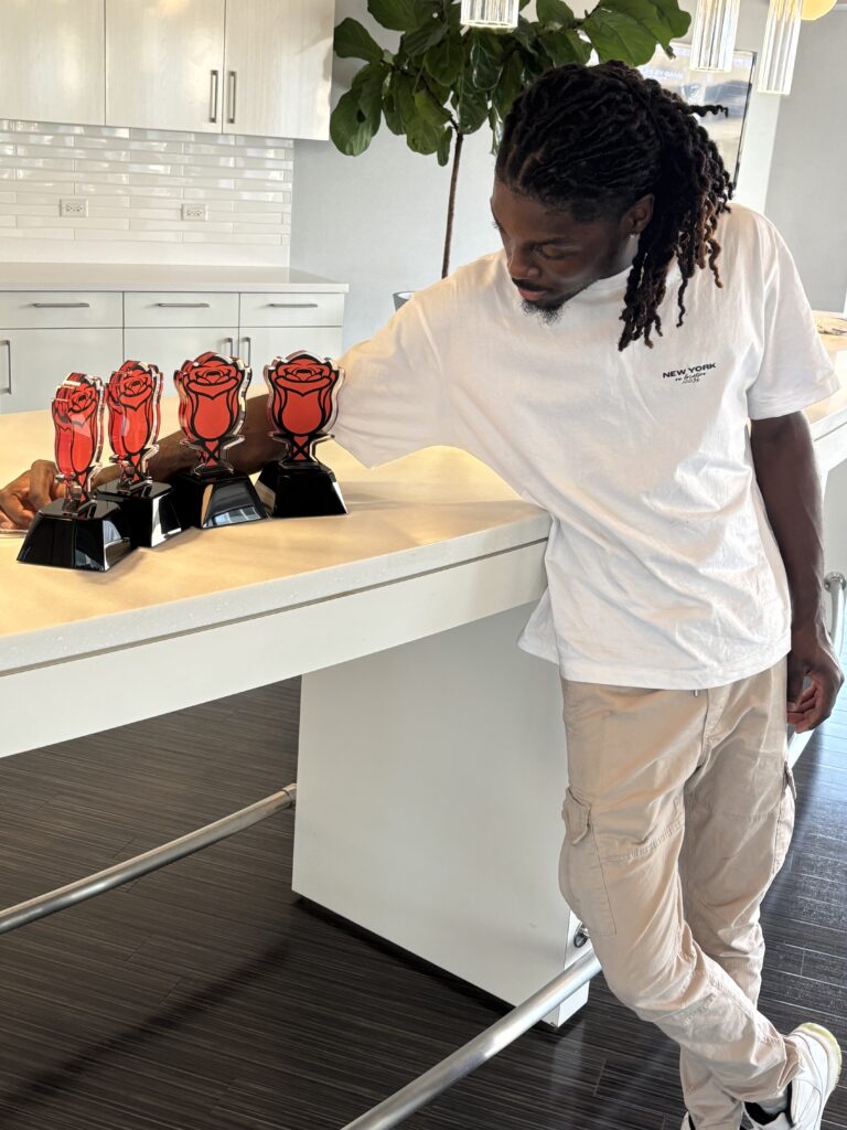 Deejay accepts 4 JBGODS Rose Awards